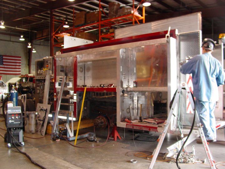 Me as a younger buck fixing a rolled Pumper truck.