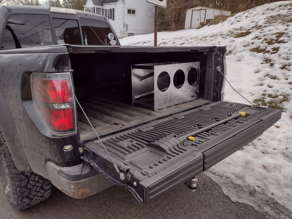 takes up a little less than half the width of the pickup bed, with some room on top, with easy access