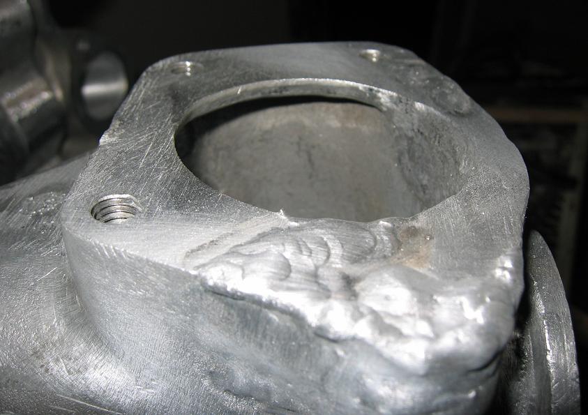 Weld beads completed in this test are shown in the bottom center and in upper right portions of this pic.